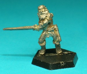 Pose 1, variant A. This figure is armed with a broad-bladed two-handed sword, and he wears hide boots and a loincloth. At his belt he carries a handaxe and a sheathed dagger, and he wears a shoulder-belt with a shield boss designed to take a plastic shield. This variant has shoulder-length hair and a straggly beard.