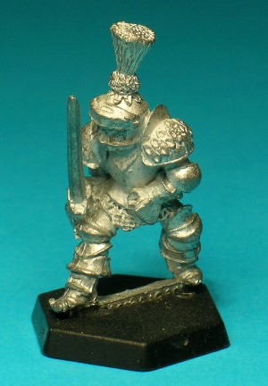 Pose 2. This figure wears a suit of full plate armour with an ornately decorated left pauldron. He also has a great helm with a tall plume and a visor. He holds a longsword in his right hand.
