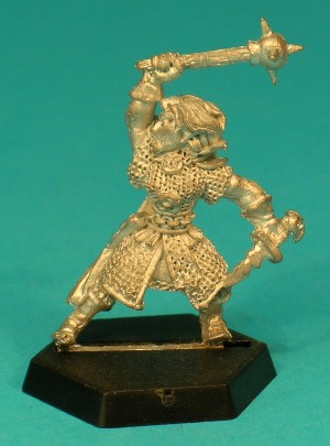 Pose 1, variant B. With her right hand, this variant swings a spiked ball-mace above her head, and she holds a short, wave-bladed dagger in her left hand. She has shoulder-length hair and is bareheaded. She looks to her right, and her mouth is open as if shouting.