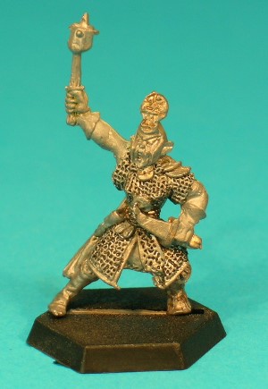 Pose 1, variant C. This variant holds a short studded mace high in her right hand, and has a short-bladed, dagger held low in her left. She has long hair and wears a full-face helmet with long cheek-guards and an ornate rounded 'lozenge' design on the front. Her face looks forwards, with her mouth open is if to shout.