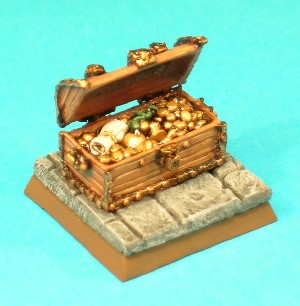 Figure 9, Treasure Chest.<br>The Treasure Chest was supplied as a two-piece casting with a seperate lid. It appears to be of wooden construction with metal reinforcing and decoration. It contains an assortment of coins and baubles, as well as a magic scroll and a small snake!